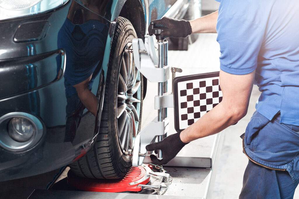 Close up view of Burt Brothers technician preparing tire alignment