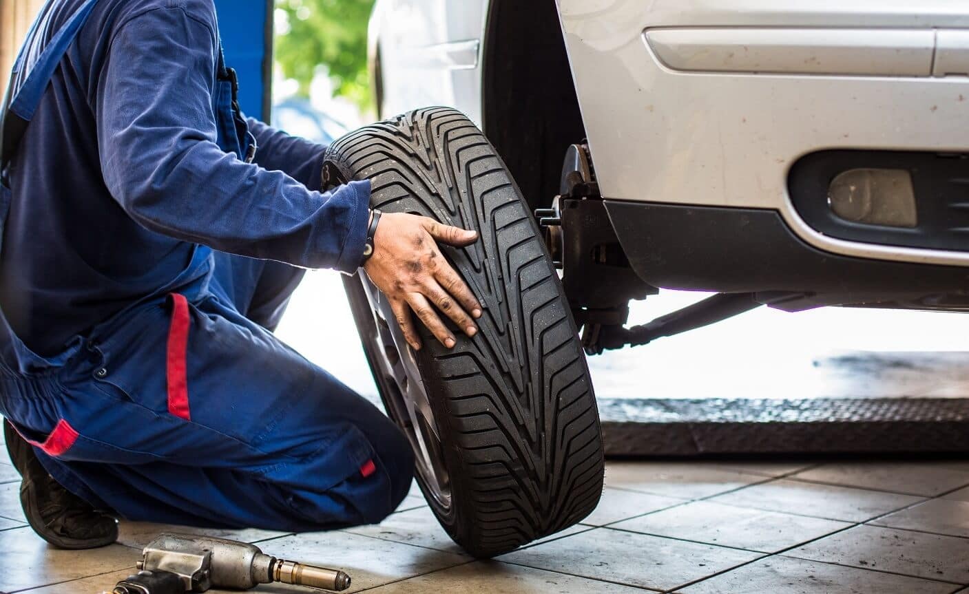 Burt Brothers technician installing new tire