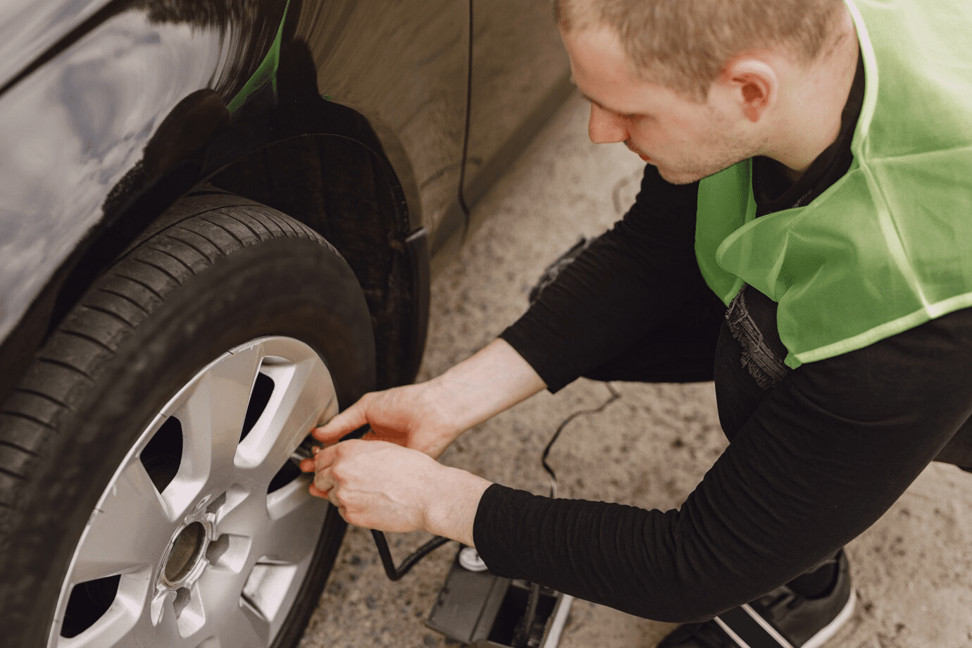 Burt Brothers technician checking tire pressure