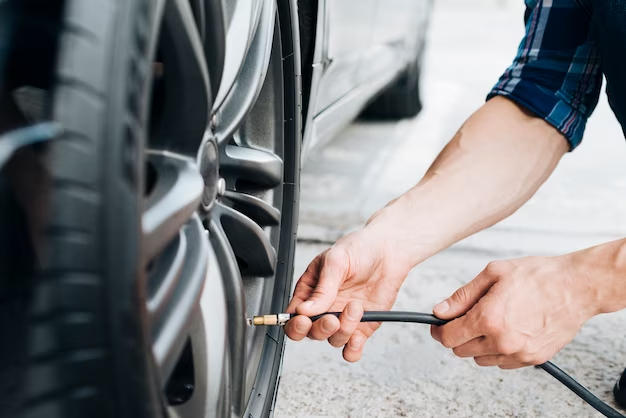Man filling a tire with a tire pump